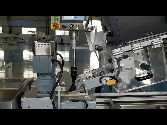 Avtomatski stroj za etiketiranje školjk v obliki črke C